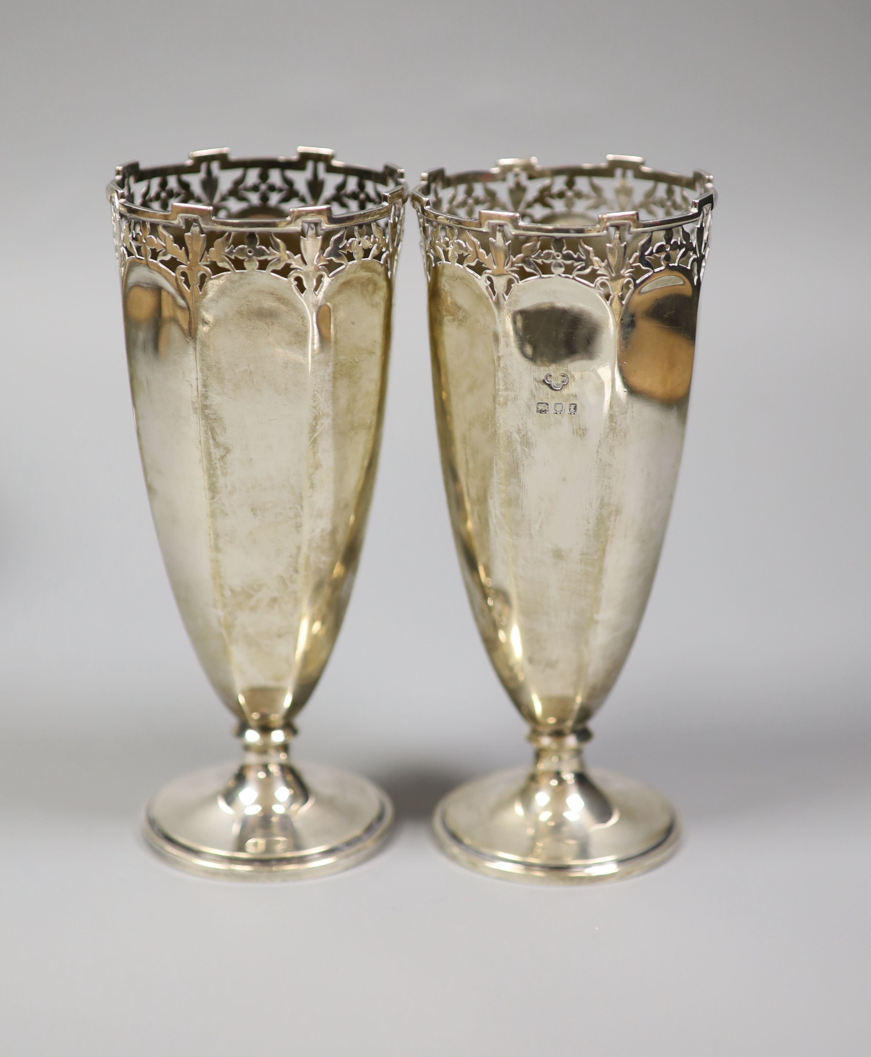 Two pairs Edwardian silver posy vases, London, 1901 and 1904, Goldsmiths & Silversmiths Co Ltd, together with a George V small pedestal bowl, Birmingham 1924 (mark rubbed) (5) total weight 24.0 ozt.